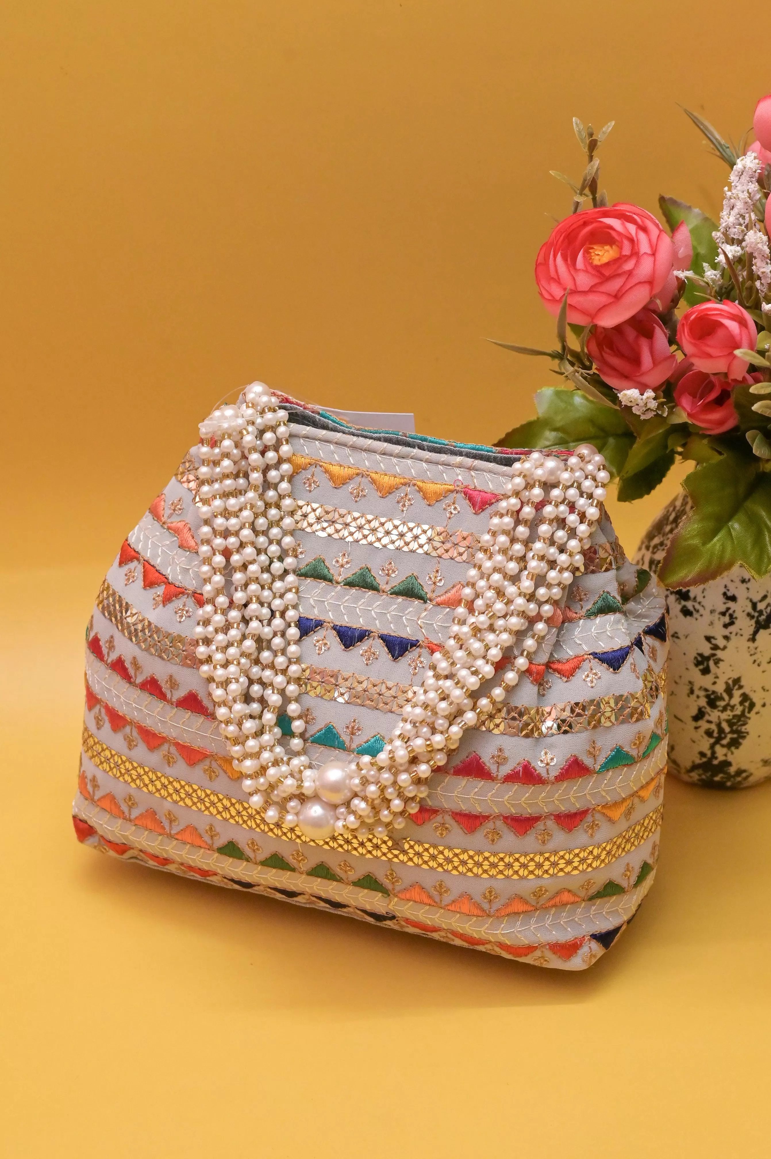 Ash Color Potli Clutch with Embroidery and Pearl Handle